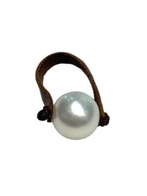Ring with single 12 mm white Australian pearl set on rolled leather band.