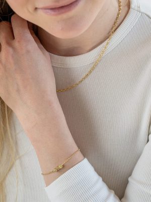 „Delicate gold bracelet, 180 mm length, adjustable to 170 mm and 160 mm, with three genuine blue-green apatite beads; handcrafted from recycled 925 sterling silver with recycled 18K gold plating, symbolizing inspiration, clarity, and self-expression.“