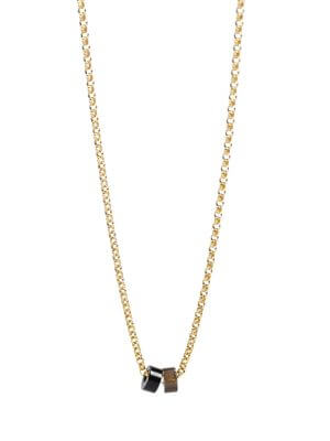„Timeless 18K gold-plated sterling silver necklace, 48 cm length, adjustable to 46 cm and 44 cm, with two crystal donut pendants in onyx and smoky quartz; handcrafted from recycled materials, symbolizing grounding, clarity, and transformation.“