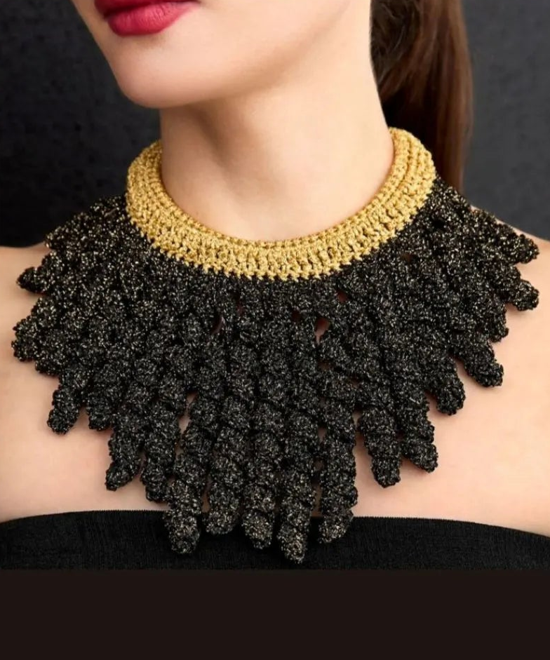 A woman dressed in black elegantly wearing the Black Princess Necklace by Lodorfo, showcasing its bold design and luxurious appeal.
